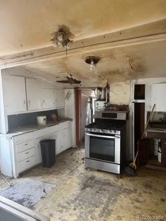 a kitchen with a stove and a microwave
