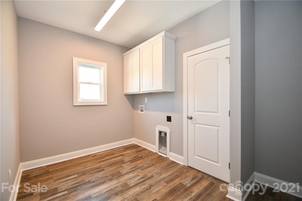 1710 McIntyre Road, Unit 4 Wingate, NC 28174 - Photo 14 of 14 an empty room with wooden floor and windows