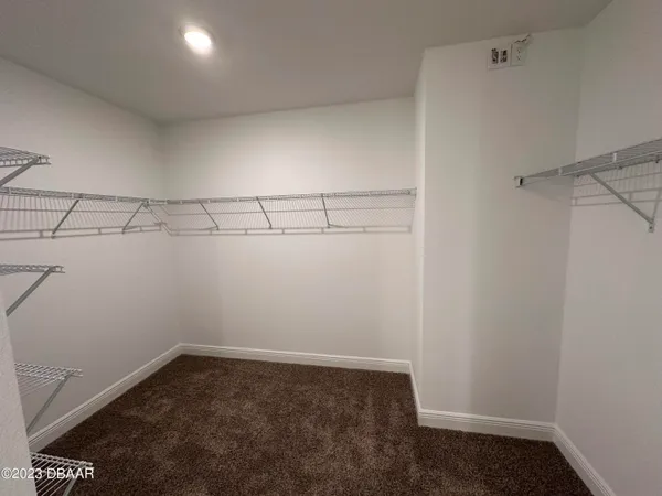 a view of a room with racks on the wall