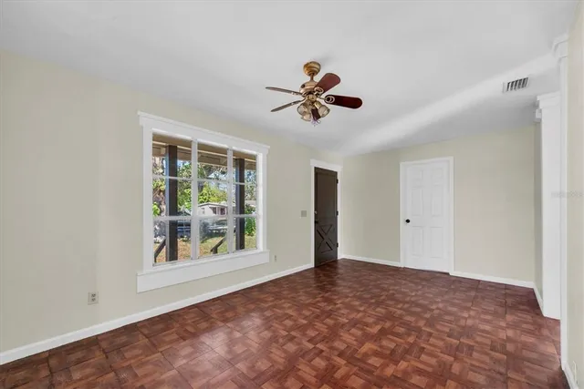 a view of an empty room with a window