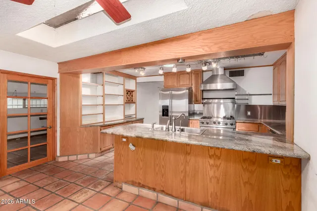 a kitchen with a sink and cabinets