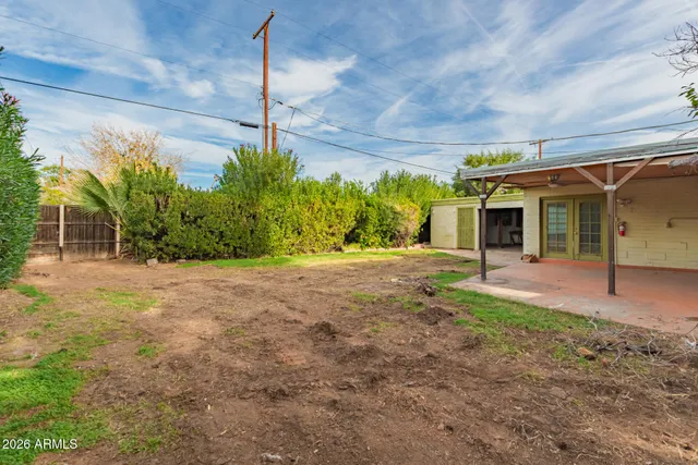 a view of a house with a tree in a yard