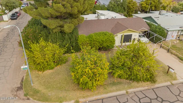 a aerial view of a house with a yard