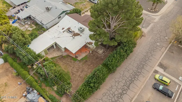 an aerial view of a house with a yard and garden