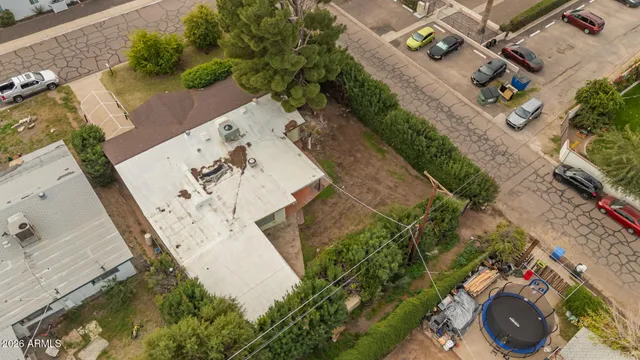 an aerial view of a house with a swimming pool