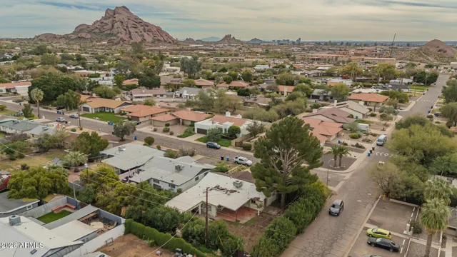 an aerial view of residential houses with outdoor space