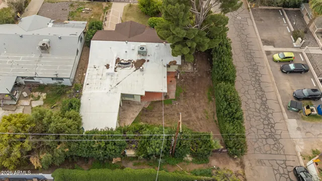 an aerial view of a house with outdoor space