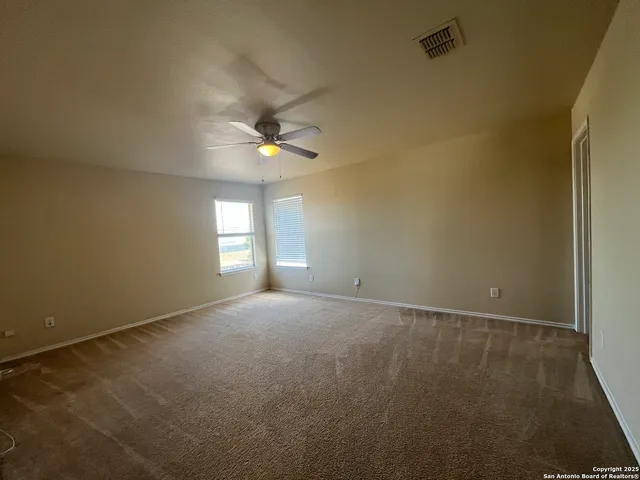 an empty room with a empty space and a window