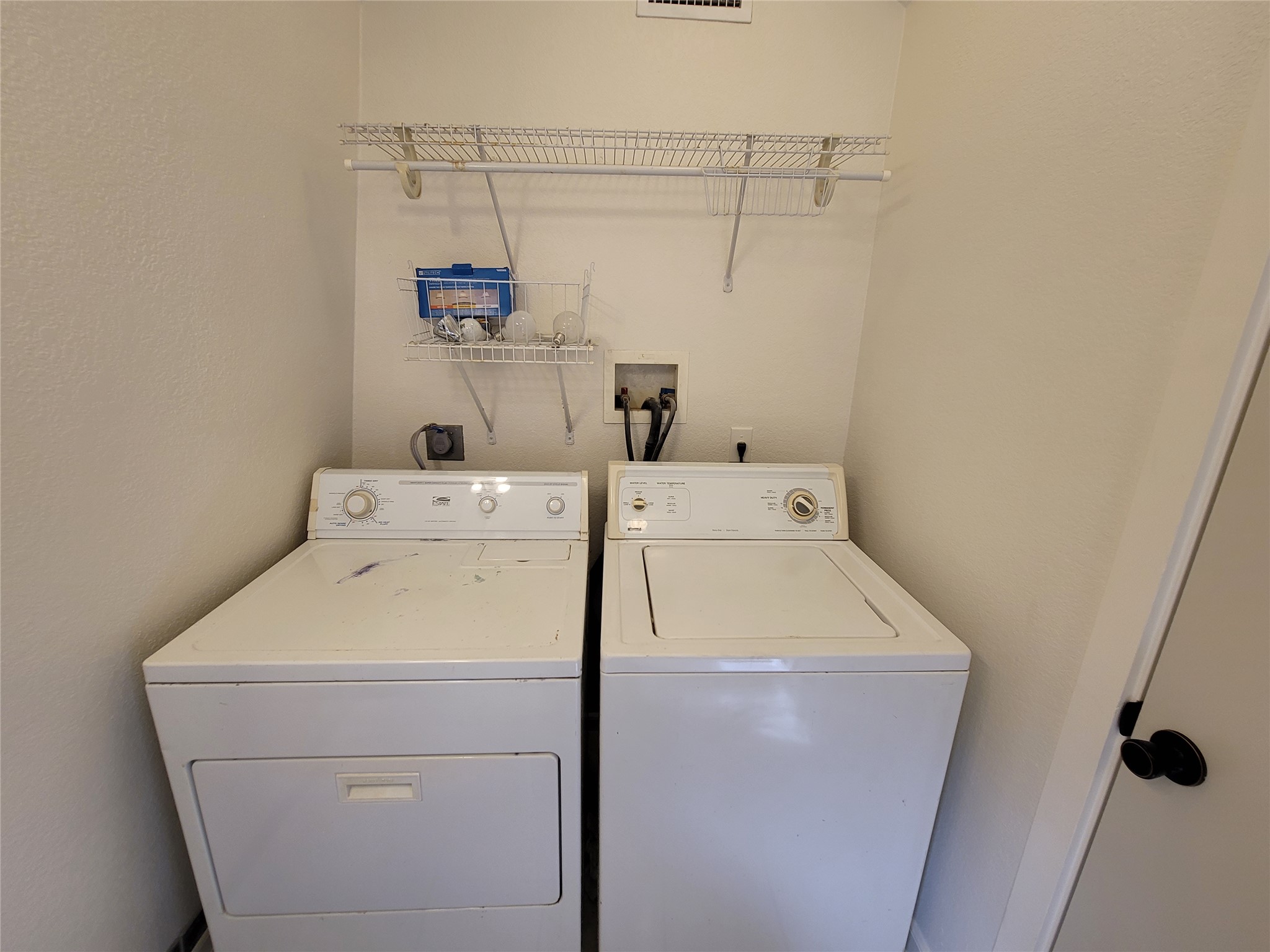 281 Earl Callahan Road, Unit A Cedar Creek, TX 78612 - Photo 32 of 39 a utility room with dryer and washer
