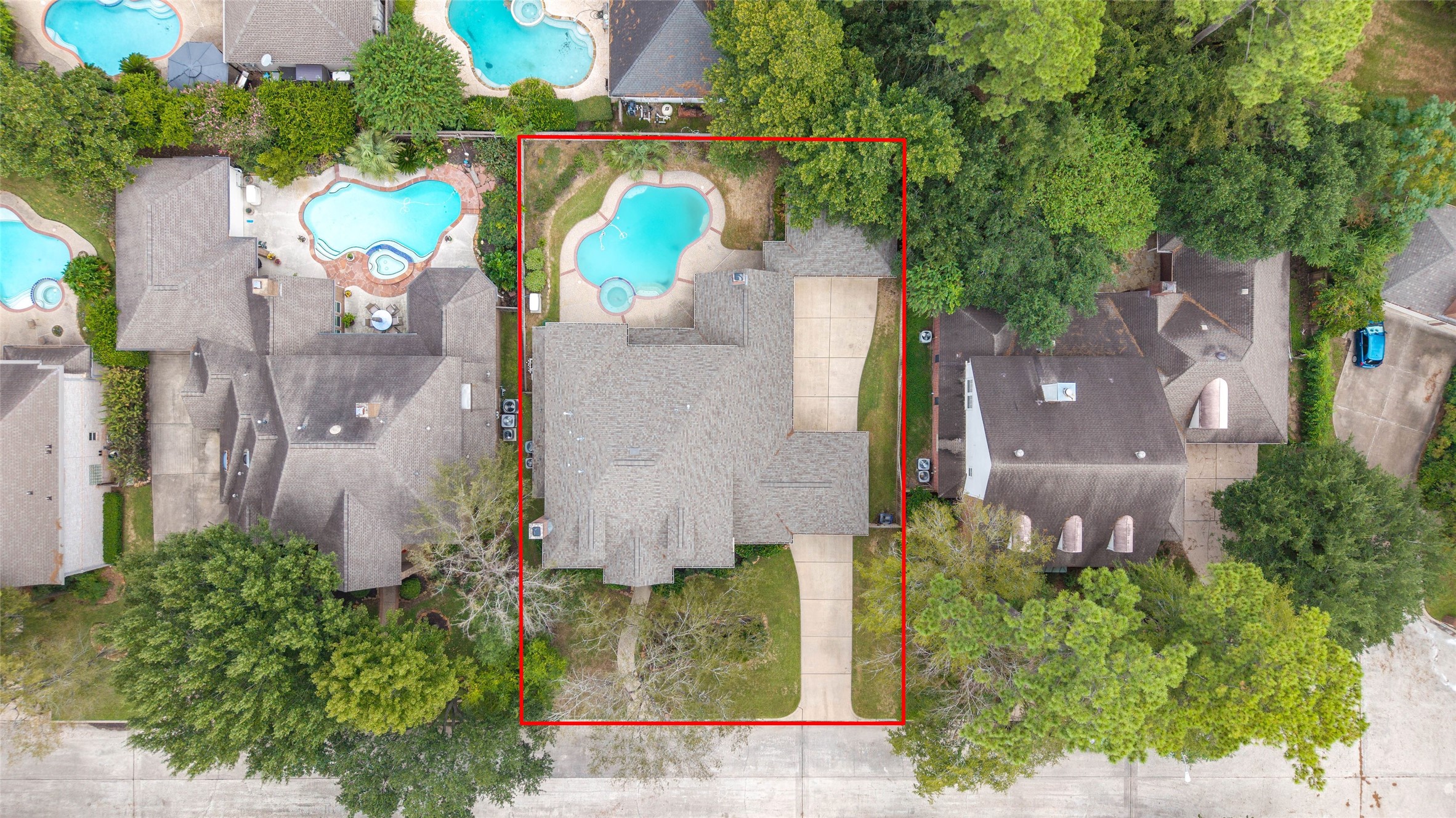 16114 Lafone Drive Spring, TX 77379 - Photo 38 of 45 Aerial view highlighting the home, backyard pool and surrounding mature trees.