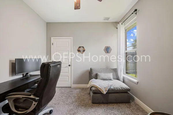 a living room with furniture and a window
