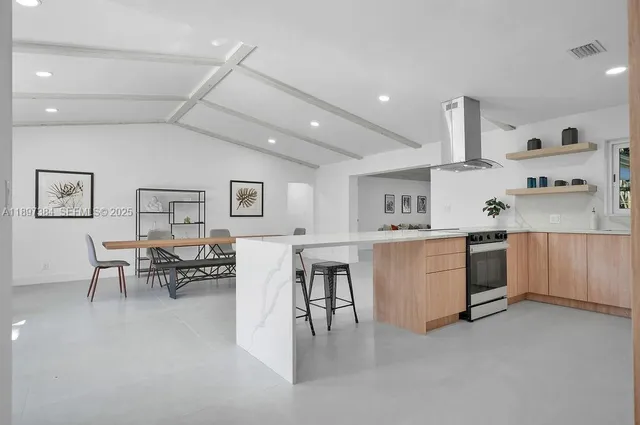 a kitchen with furniture and a table