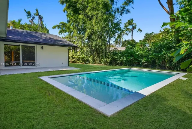 a view of a backyard with a patio