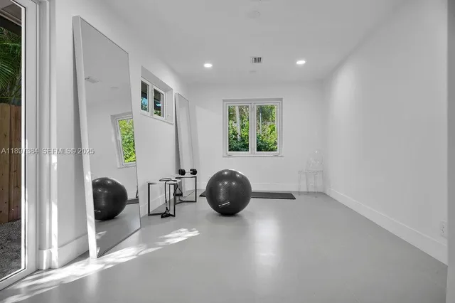 a bedroom with bed and a window