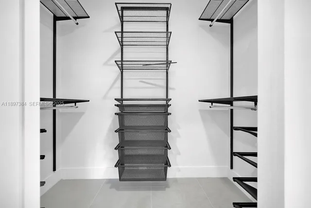 a bathroom with a toilet a sink and shower