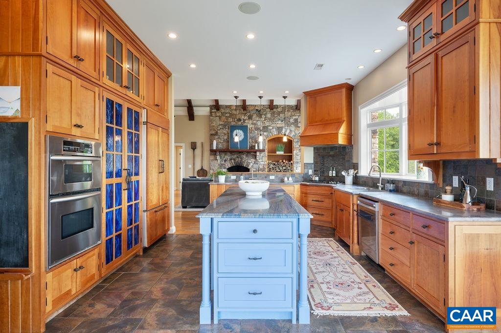 513 Half Mile Branch Road Crozet, VA 22932 - Photo 13 of 57 a large kitchen with stainless steel appliances granite countertop a large stove a sink and dishwasher