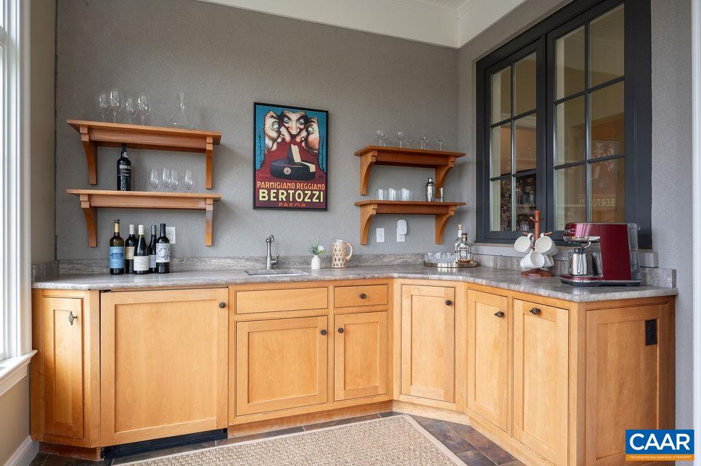 513 Half Mile Branch Road Crozet, VA 22932 - Photo 15 of 57 a kitchen with granite countertop white cabinets and window