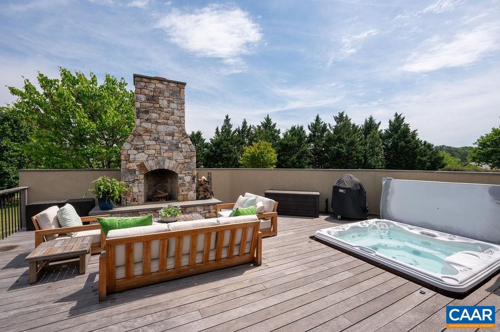 513 Half Mile Branch Road Crozet, VA 22932 - Photo 16 of 57 a terrace of a house with wooden floor and outdoor seating