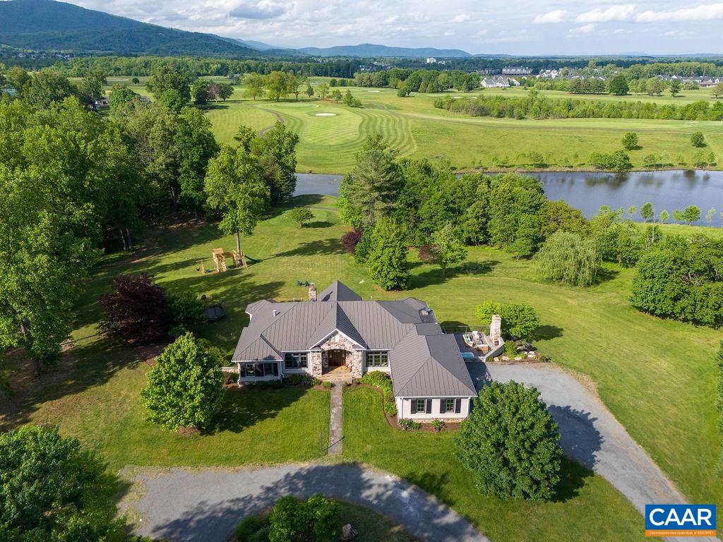 513 Half Mile Branch Road Crozet, VA 22932 - Photo 2 of 57 an aerial view of a house with a garden and lake view