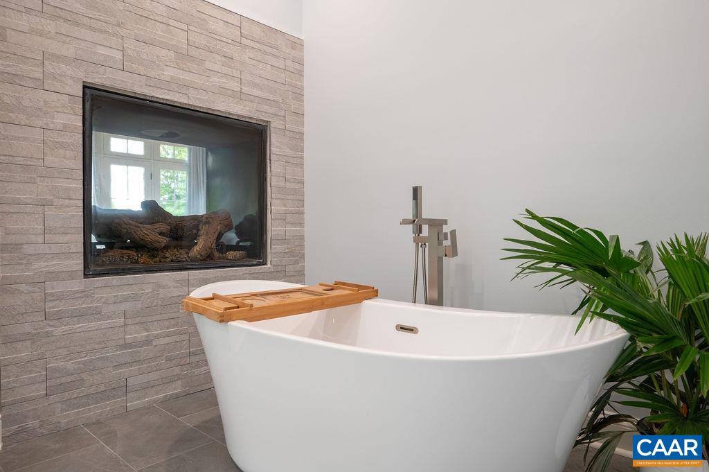 513 Half Mile Branch Road Crozet, VA 22932 - Photo 24 of 57 a white bath tub sitting in a bathroom