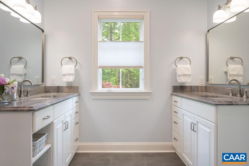 513 Half Mile Branch Road Crozet, VA 22932 - Photo 25 of 57 a bathroom with a granite countertop sink a mirror and a window