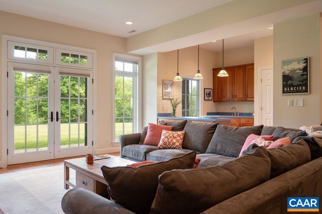 513 Half Mile Branch Road Crozet, VA 22932 - Photo 28 of 57 a living room with furniture and a large window