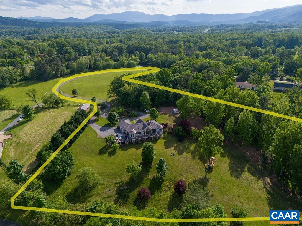 513 Half Mile Branch Road Crozet, VA 22932 - Photo 3 of 57 a view of a back yard from a balcony