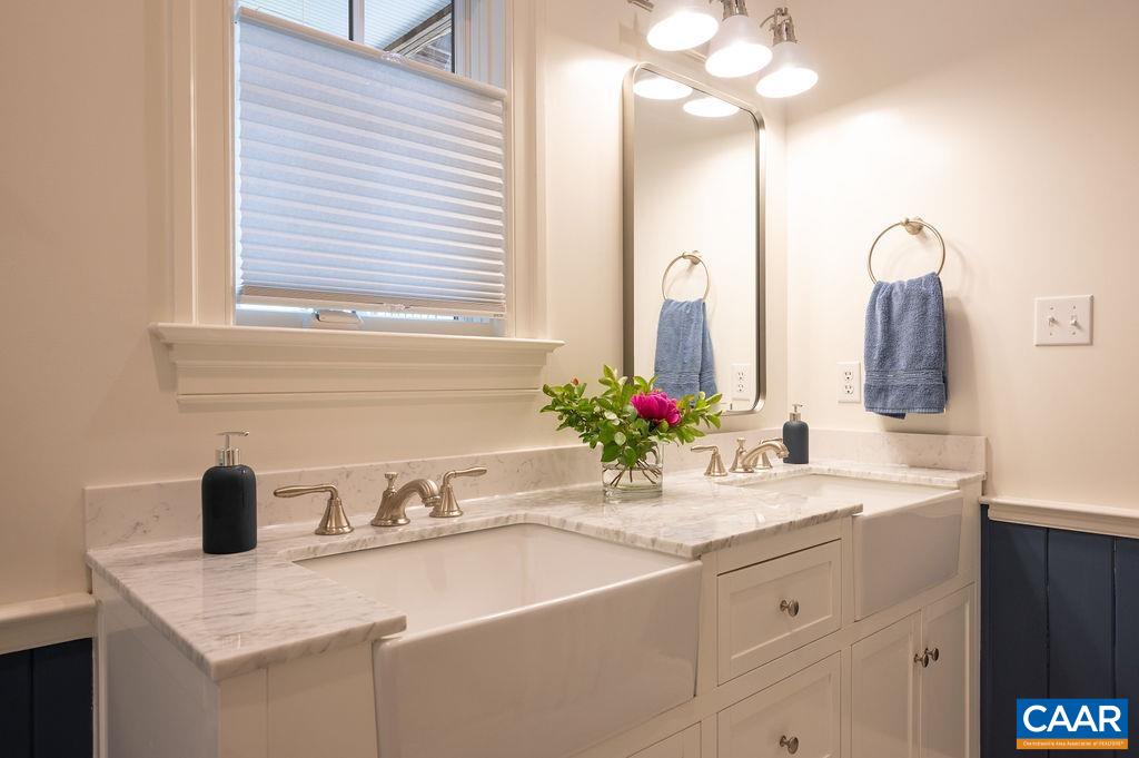 513 Half Mile Branch Road Crozet, VA 22932 - Photo 31 of 57 a bathroom with a sink and a mirror