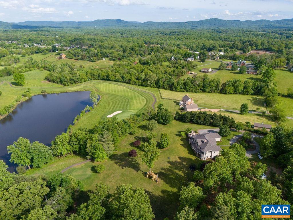 513 Half Mile Branch Road Crozet, VA 22932 - Photo 4 of 57 an aerial view of green landscape with trees houses and mountain view