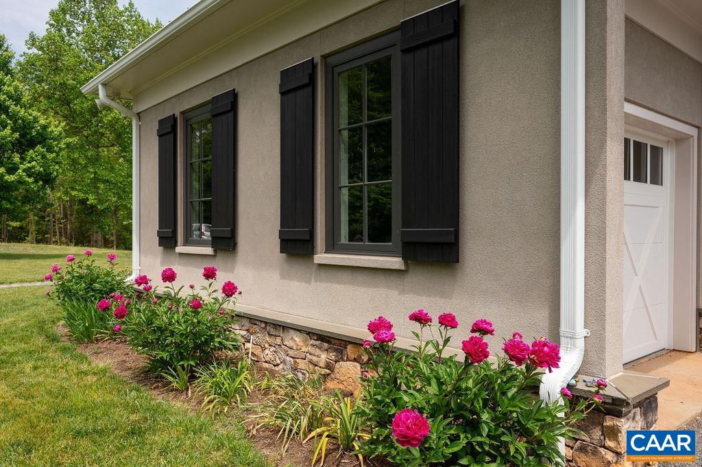 513 Half Mile Branch Road Crozet, VA 22932 - Photo 44 of 57 a flower plants in front of a house