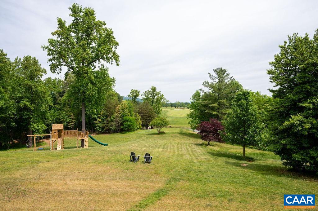 513 Half Mile Branch Road Crozet, VA 22932 - Photo 45 of 57 a view of a swimming pool with a bench and trees around