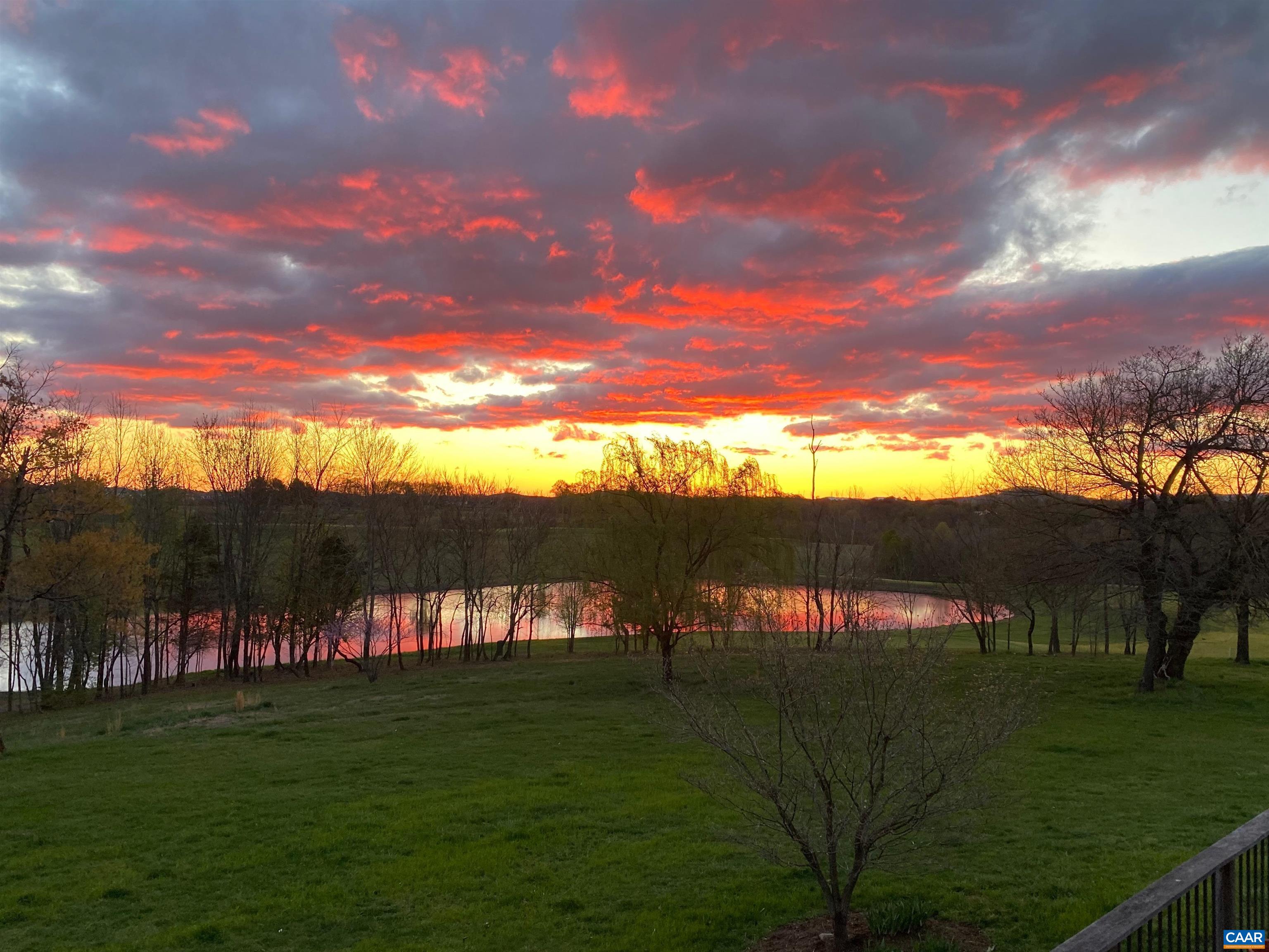 513 Half Mile Branch Road Crozet, VA 22932 - Photo 46 of 57 a view of a lake with a yard