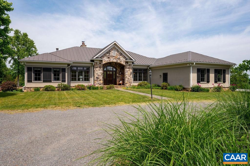 513 Half Mile Branch Road Crozet, VA 22932 - Photo 5 of 57 a front view of a house with a yard and trees