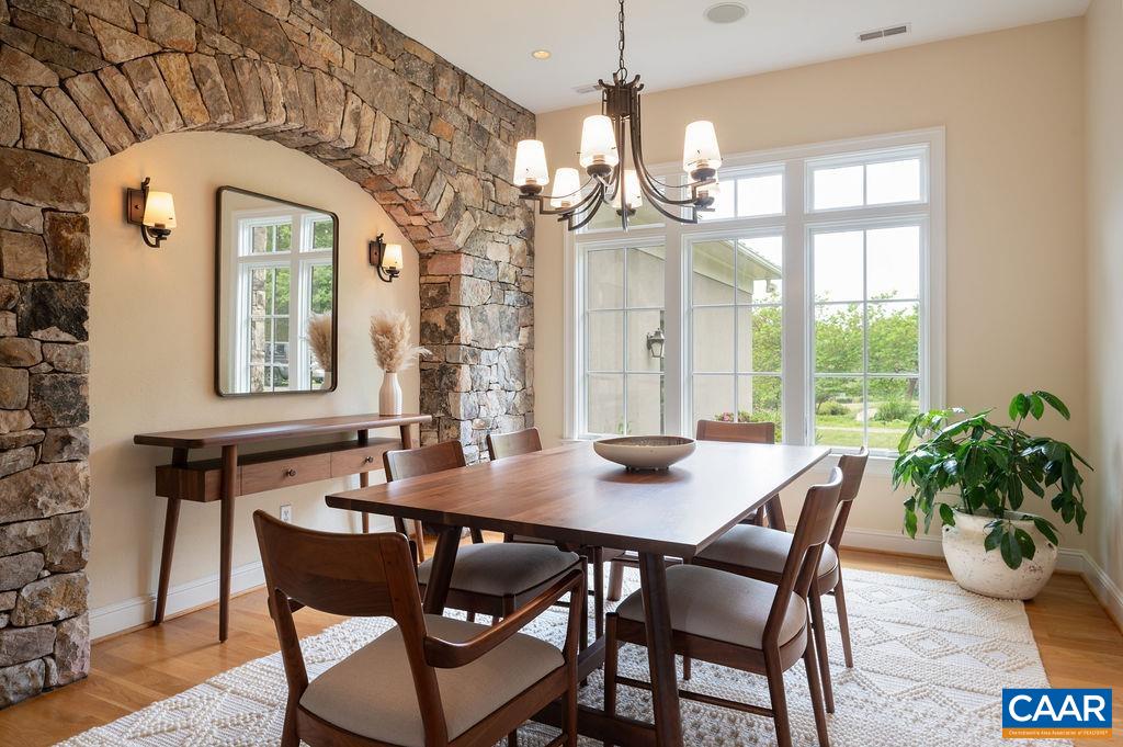 513 Half Mile Branch Road Crozet, VA 22932 - Photo 8 of 57 a view of a dining room with furniture window and wooden floor