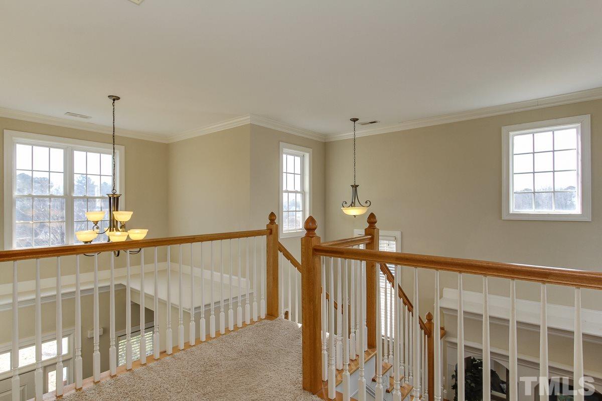 4740 Swordfish Drive Raleigh, NC 27603 - Photo 14 of 25 a view of an empty room with stairs