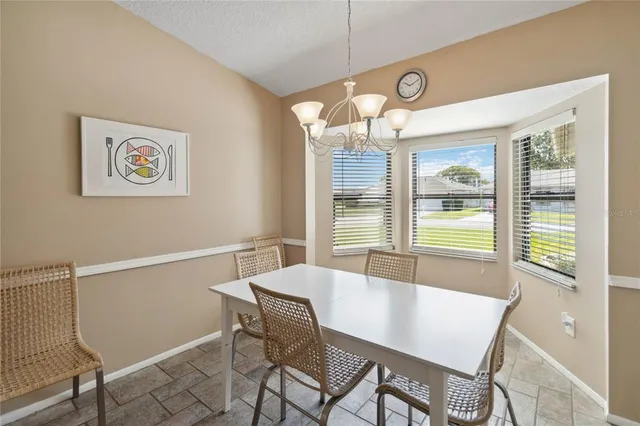 a living room with furniture a desk and chair