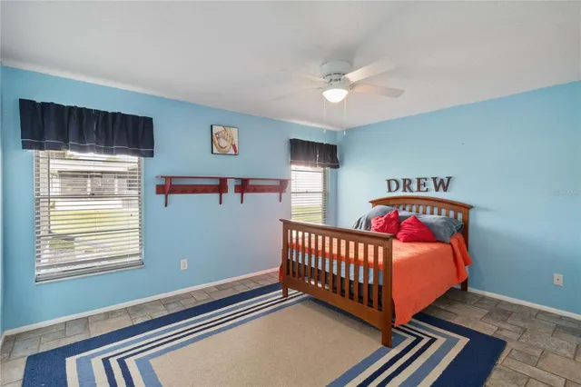 a view of a back yard with a table and chairs