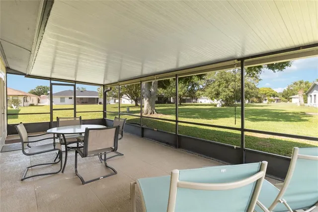 an aerial view of a house with garden space and street view