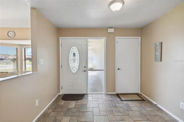 a kitchen with kitchen island granite countertop a sink a counter top space appliances and cabinets