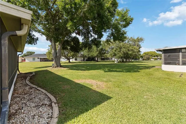 a view of a garden with a building