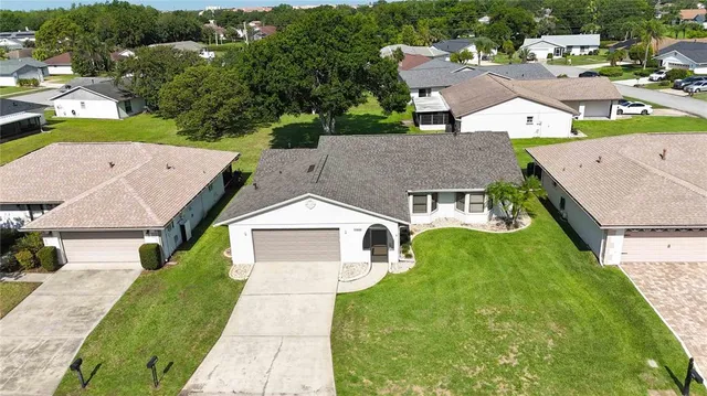 an aerial view of a house with a garden