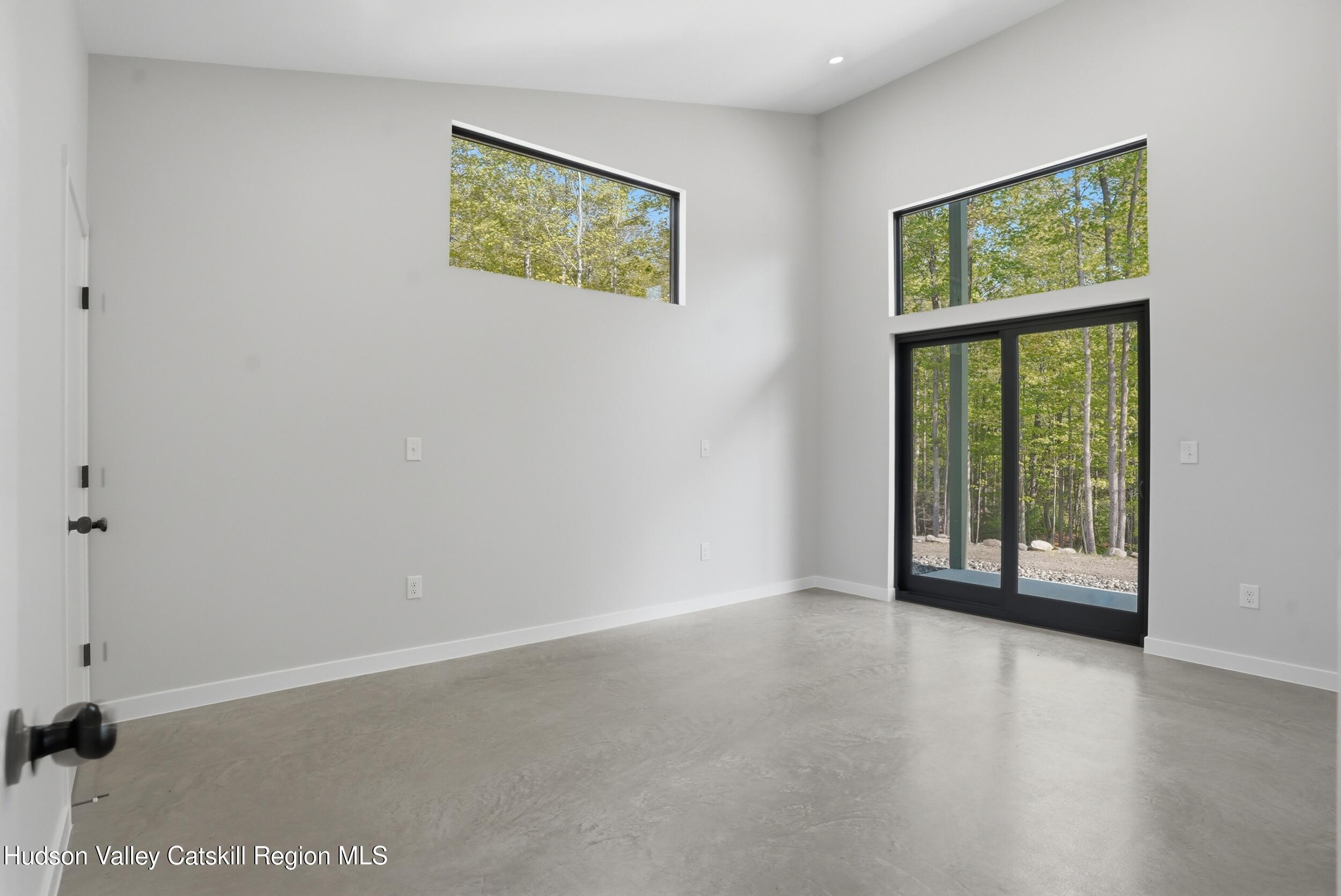 349 High Point Mountain Road West Shokan, NY 12494 - Photo 17 of 25 an empty room with windows and closet