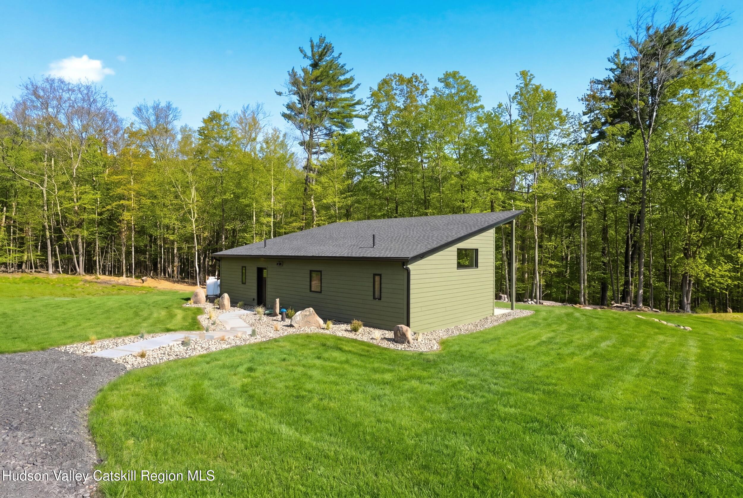 349 High Point Mountain Road West Shokan, NY 12494 - Photo 3 of 25 a front view of a house with garden