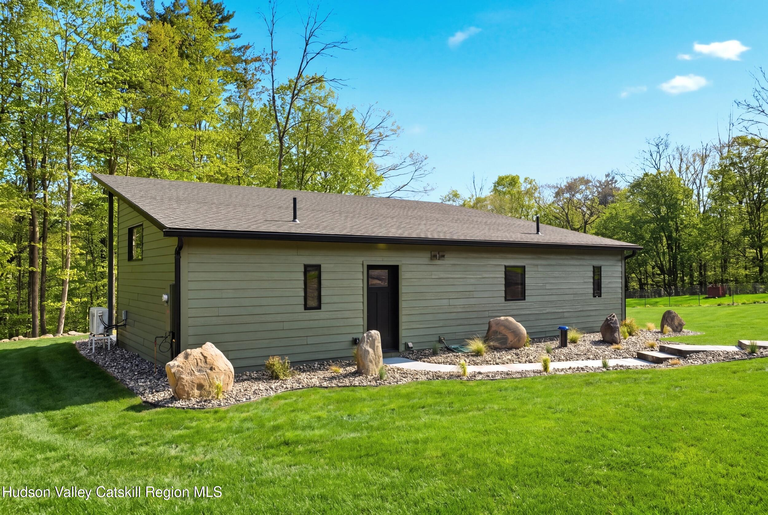 349 High Point Mountain Road West Shokan, NY 12494 - Photo 4 of 25 a front view of house with yard and outdoor seating