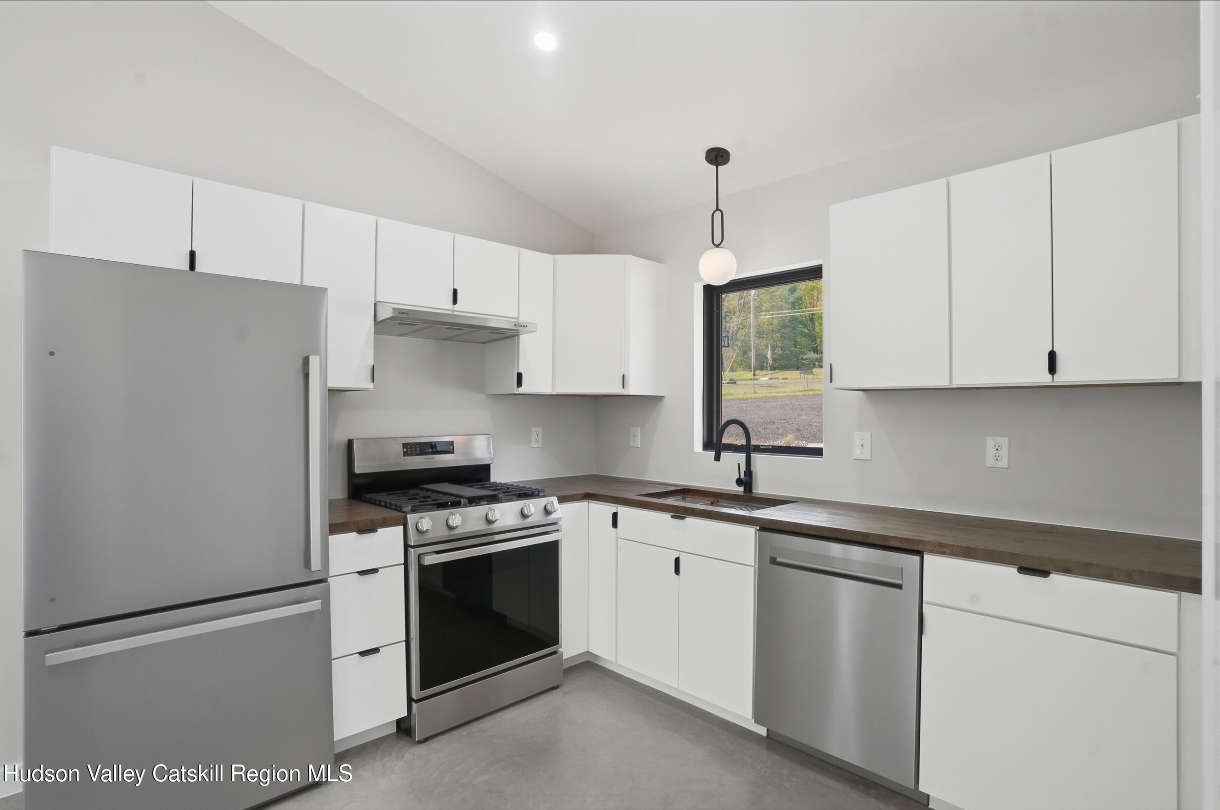 349 High Point Mountain Road West Shokan, NY 12494 - Photo 10 of 25 a kitchen with cabinets stainless steel appliances and a counter space