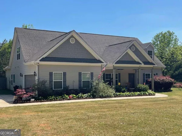 a front view of a house with a yard