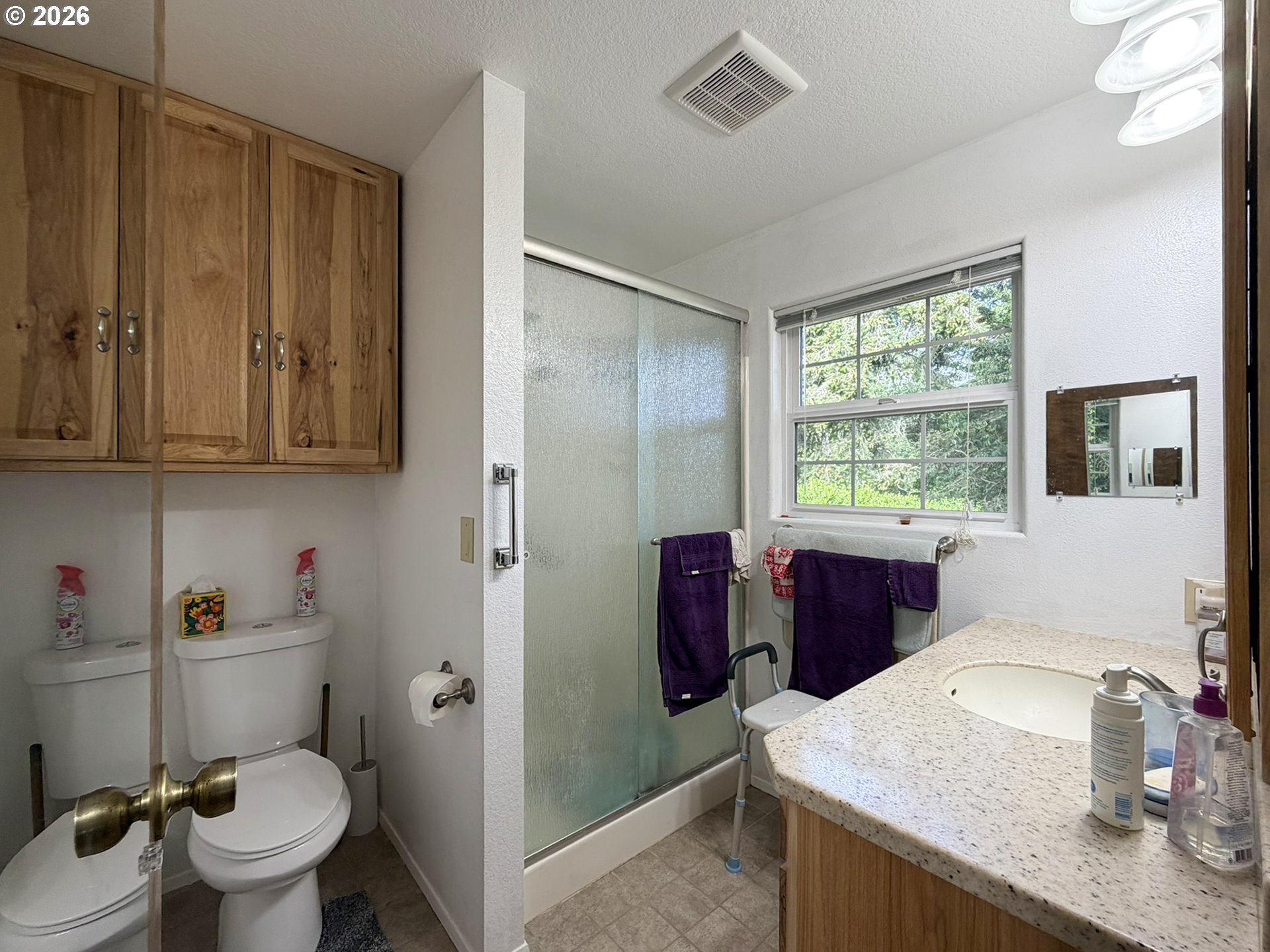 1372 Hampton Road Brookings, OR 97415 - Photo 26 of 42 a bathroom with a granite countertop sink toilet and shower