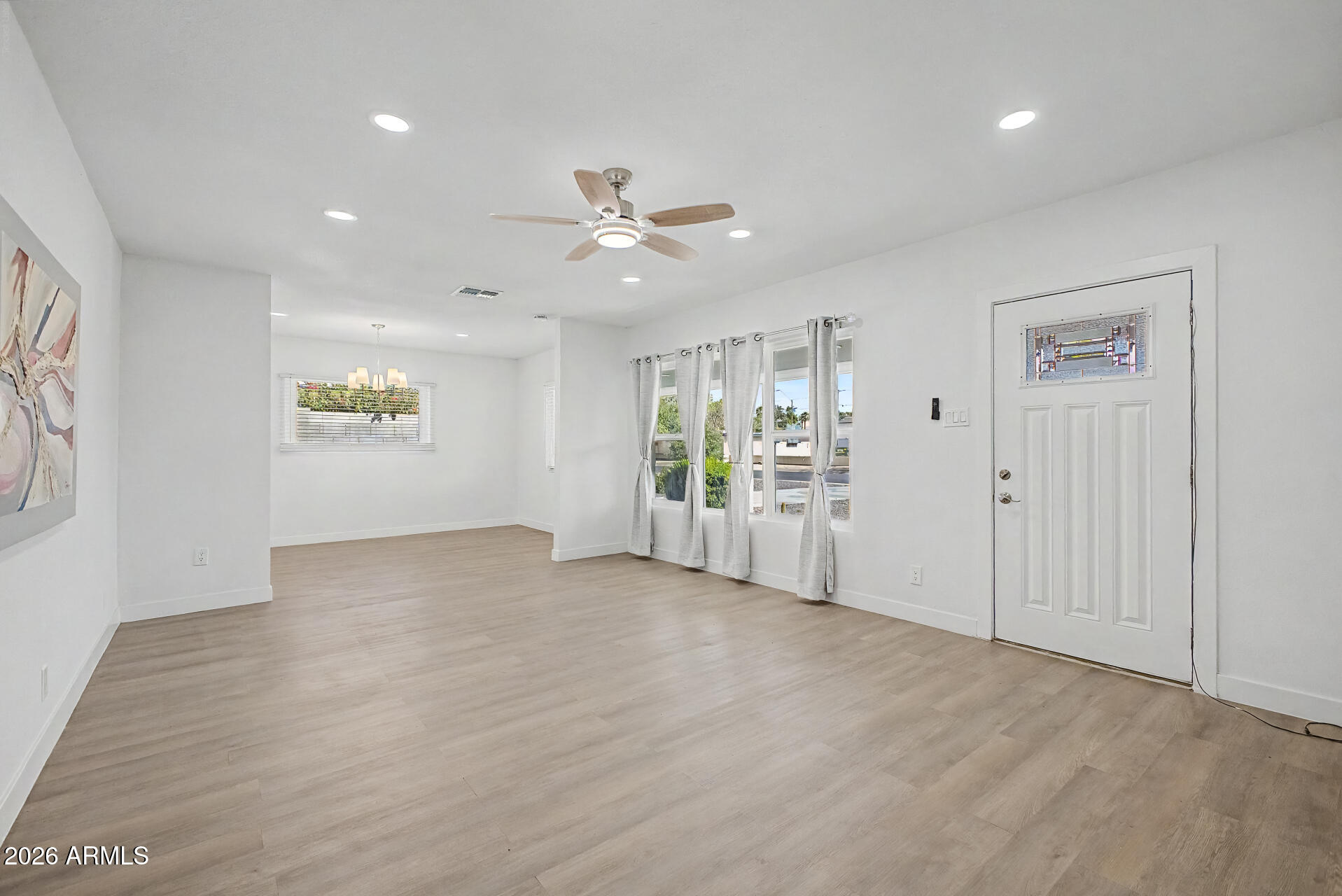 532 East Cheery Lynn Road Phoenix, AZ 85014 - Photo 7 of 37 a view of an empty room with a window
