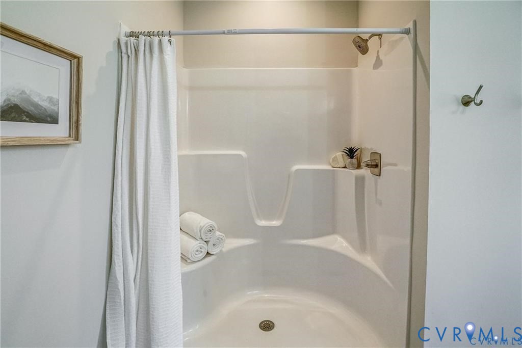 Lot 1 Three Chopt Road Louisa, VA 23093 - Photo 25 of 37 Shower-tub combination featuring integrated shelvi