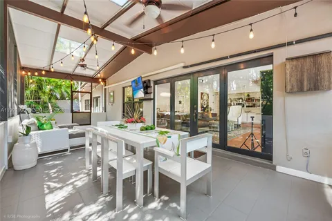 a view of a dining room with furniture window and outside view